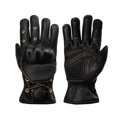 Pair of black leather gloves with decorative elements on a white background